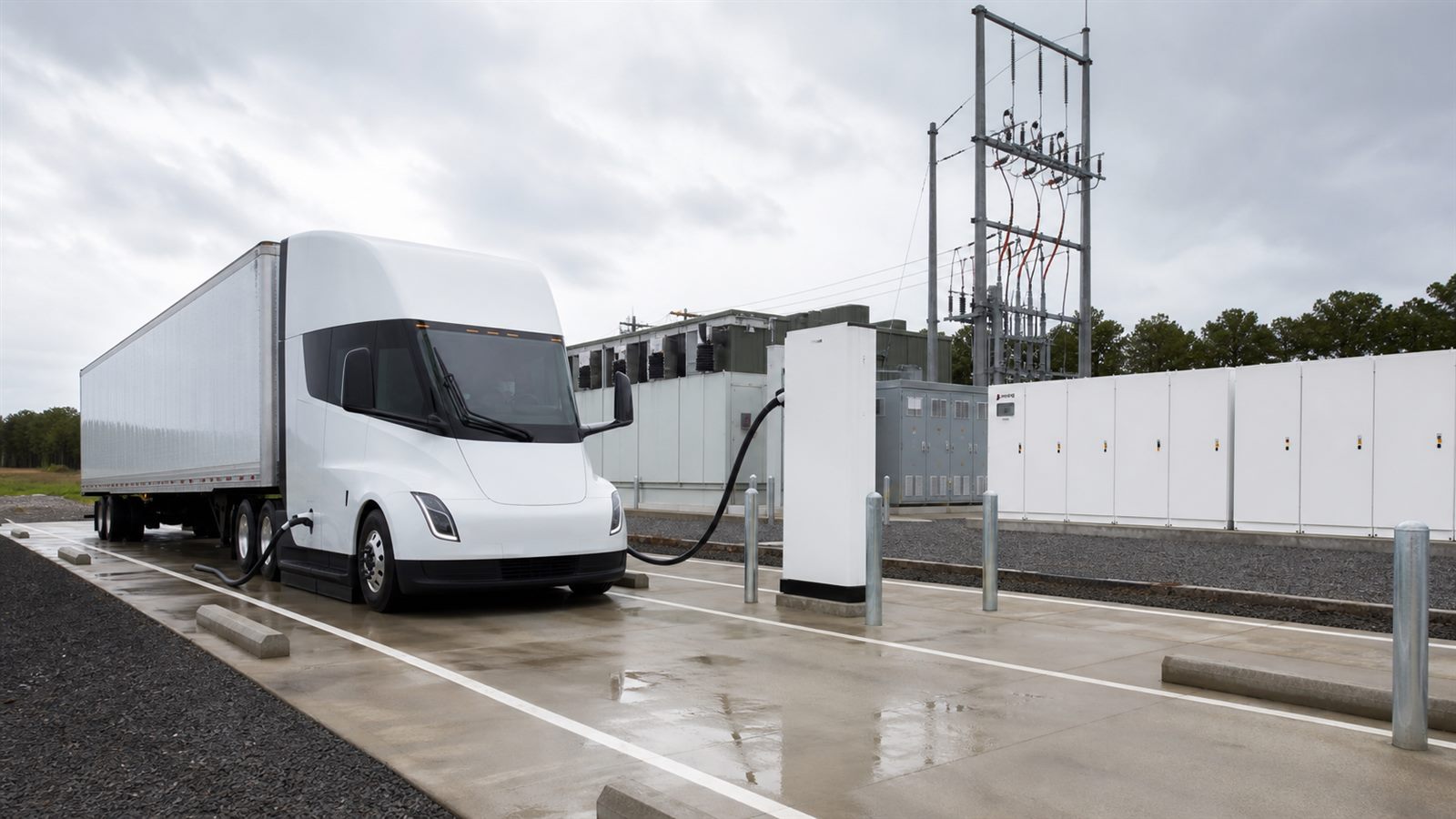 Generic electric semi-truck connected to a cooled high-power charger at a pull-through depot bay